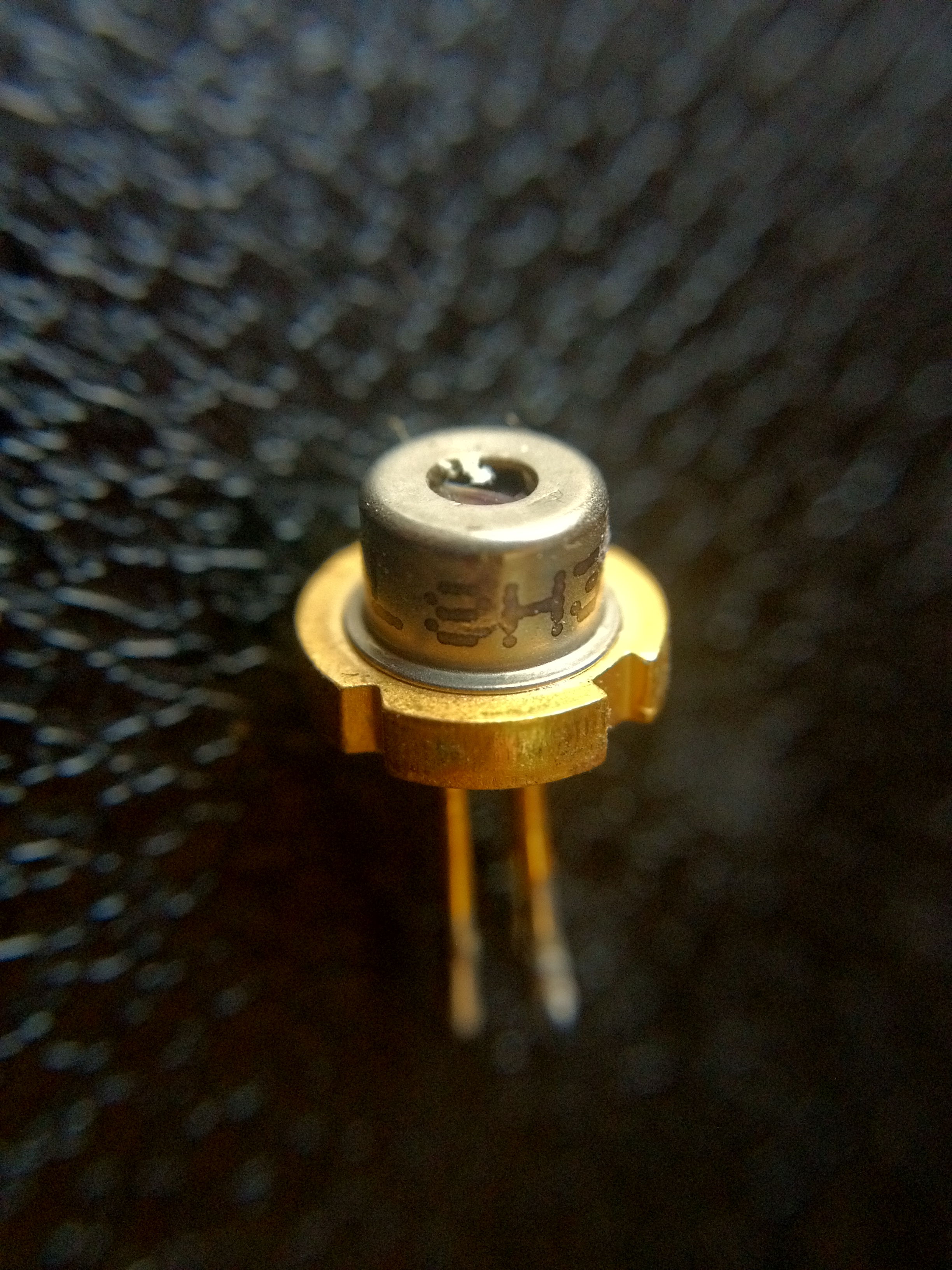 The laser diode mounted into a brass lens-holder collar as part of the collimation mount