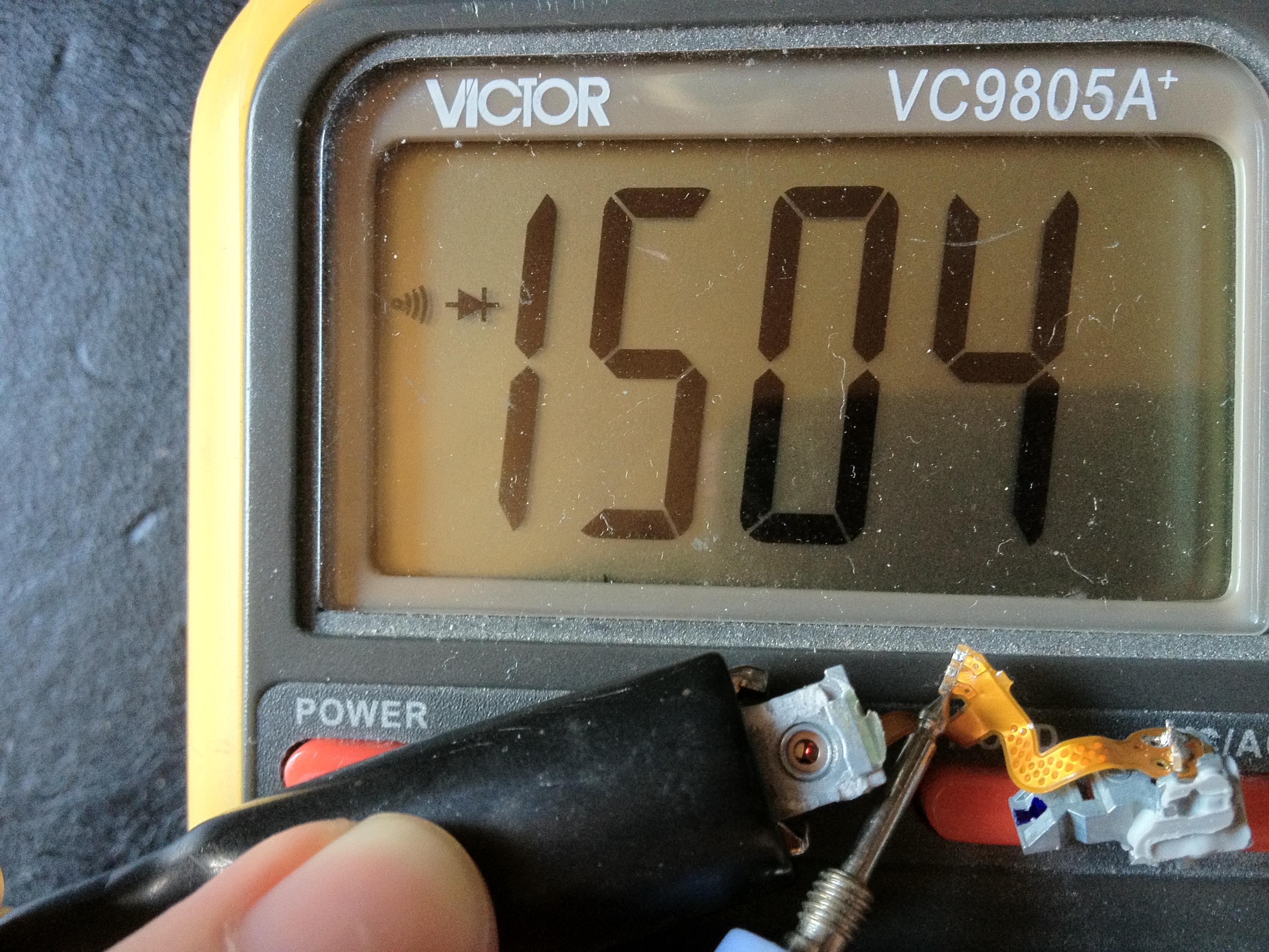 A laser diode under test, visibly glowing red — this is what Class 3B actually looks like in practice