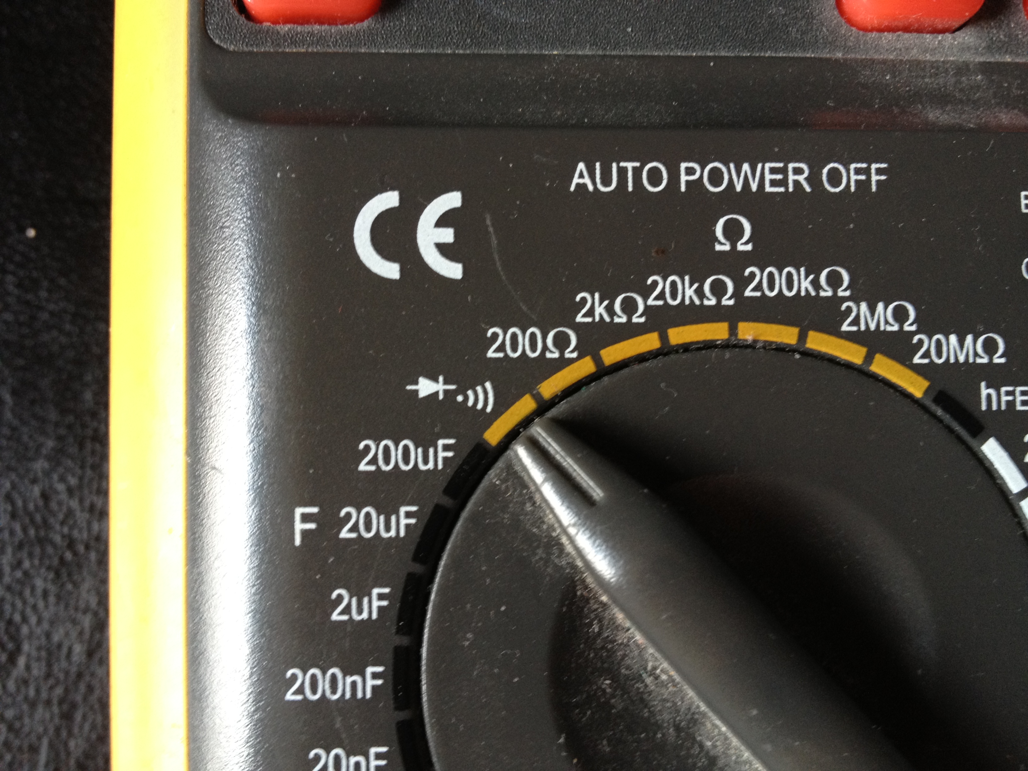 Close-up of a multimeter selector dial set to the diode-test range, used to identify the laser diode polarity and type